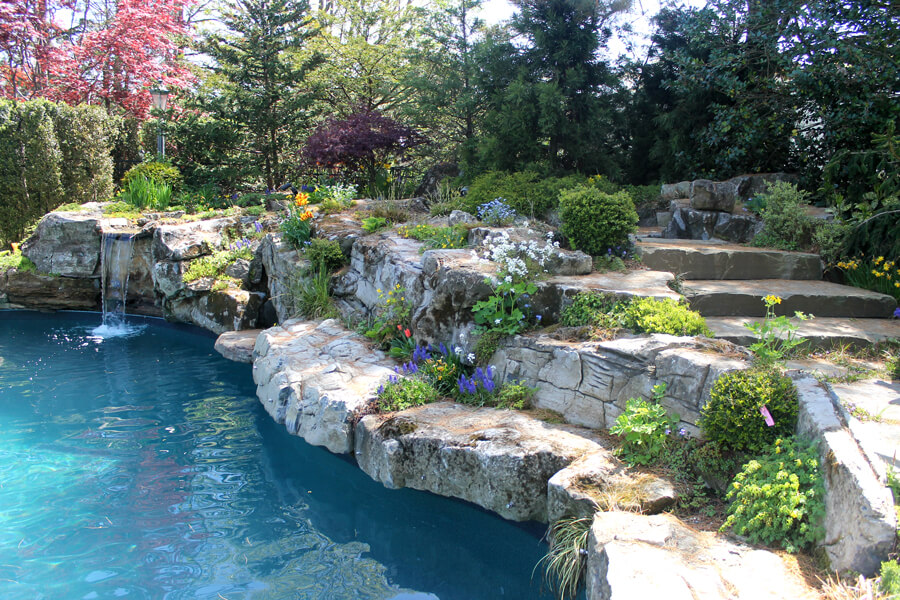 Waterfall into pool showing Landscape and Pool Design NY Area